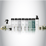 Zenagen haircare product lineup displayed on a white background, featuring Revolve, Evolve, and Eclipse shampoos and conditioners alongside styling and treatment products, arranged in a clean, professional row with botanical accents