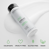 White bottle of Zenagen Evolve Nourishing Conditioner on a light gray background with brand icons below.