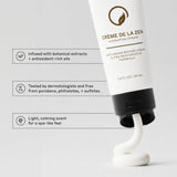 Zenagen Crème de la Zen Hydrating Cream product benefits infographic highlighting its dermatologist-tested, paraben-free, and botanical-infused formula alongside a swirl of the rich white cream.