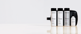 Zenagen Revolve hair care collection featuring men's shampoo, women's shampoo, conditioner, and densifying hair serum for fine and visibly thinning hair.