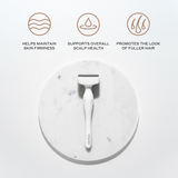 White derma stamp tool on a marble surface with icons and text about skin firmness, scalp health, and hair promotion.